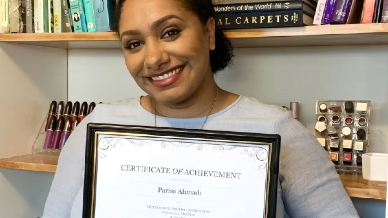Parisa with award