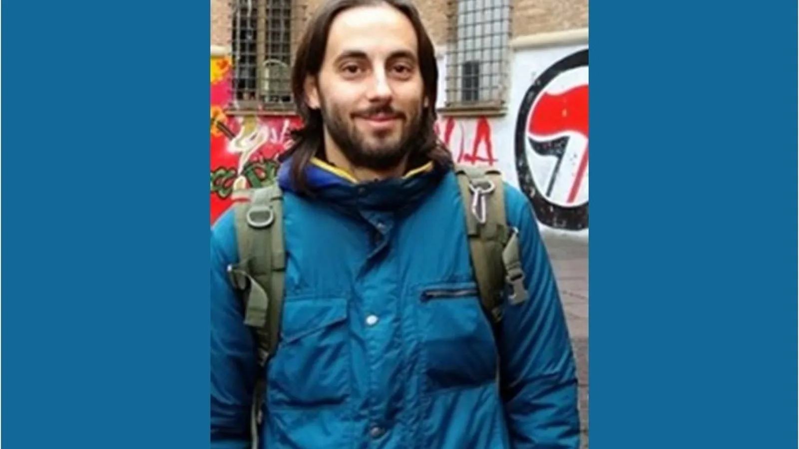 Enrico wearing a blue jacket