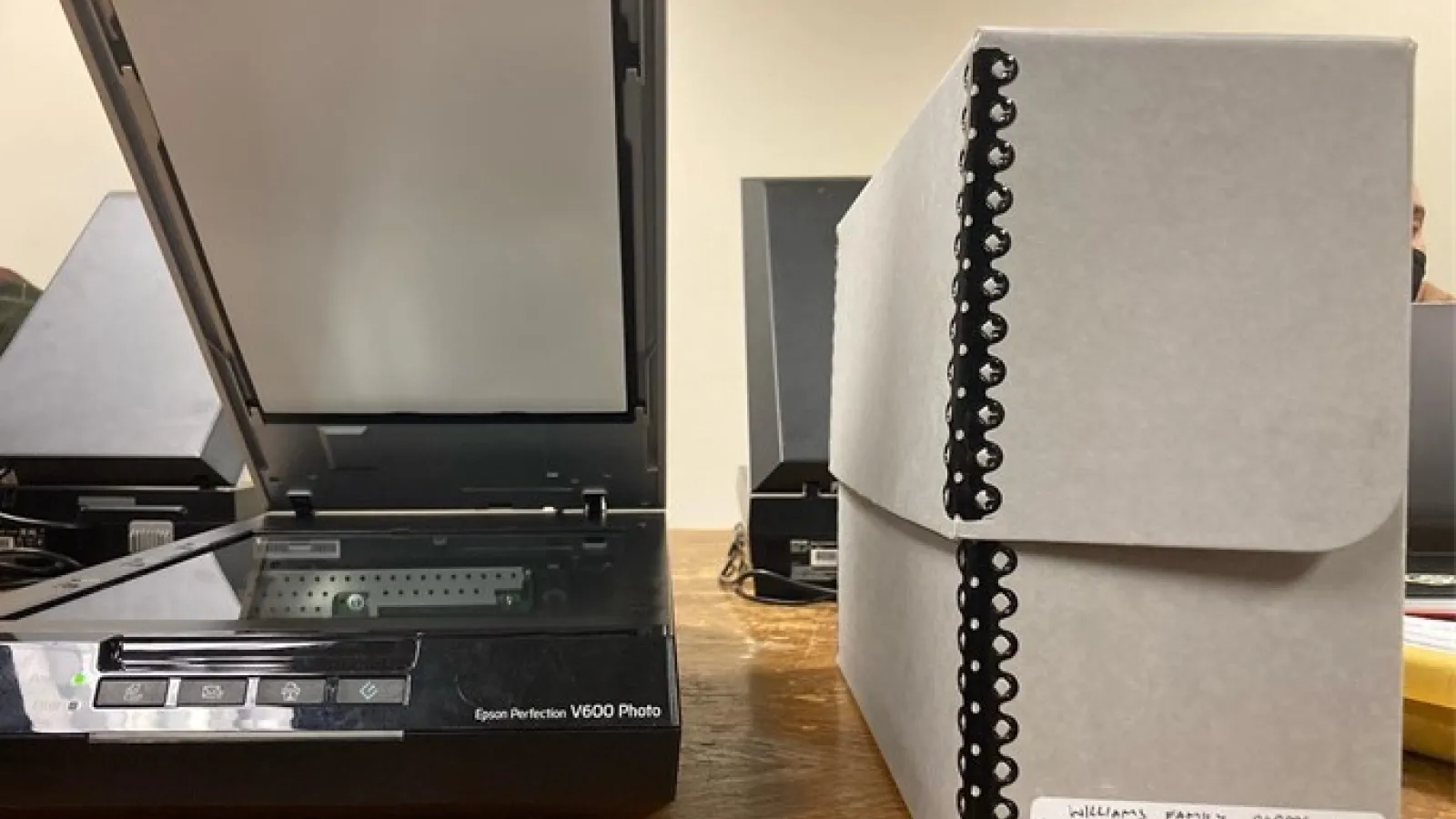Photo of scanner and archive box sitting on a table