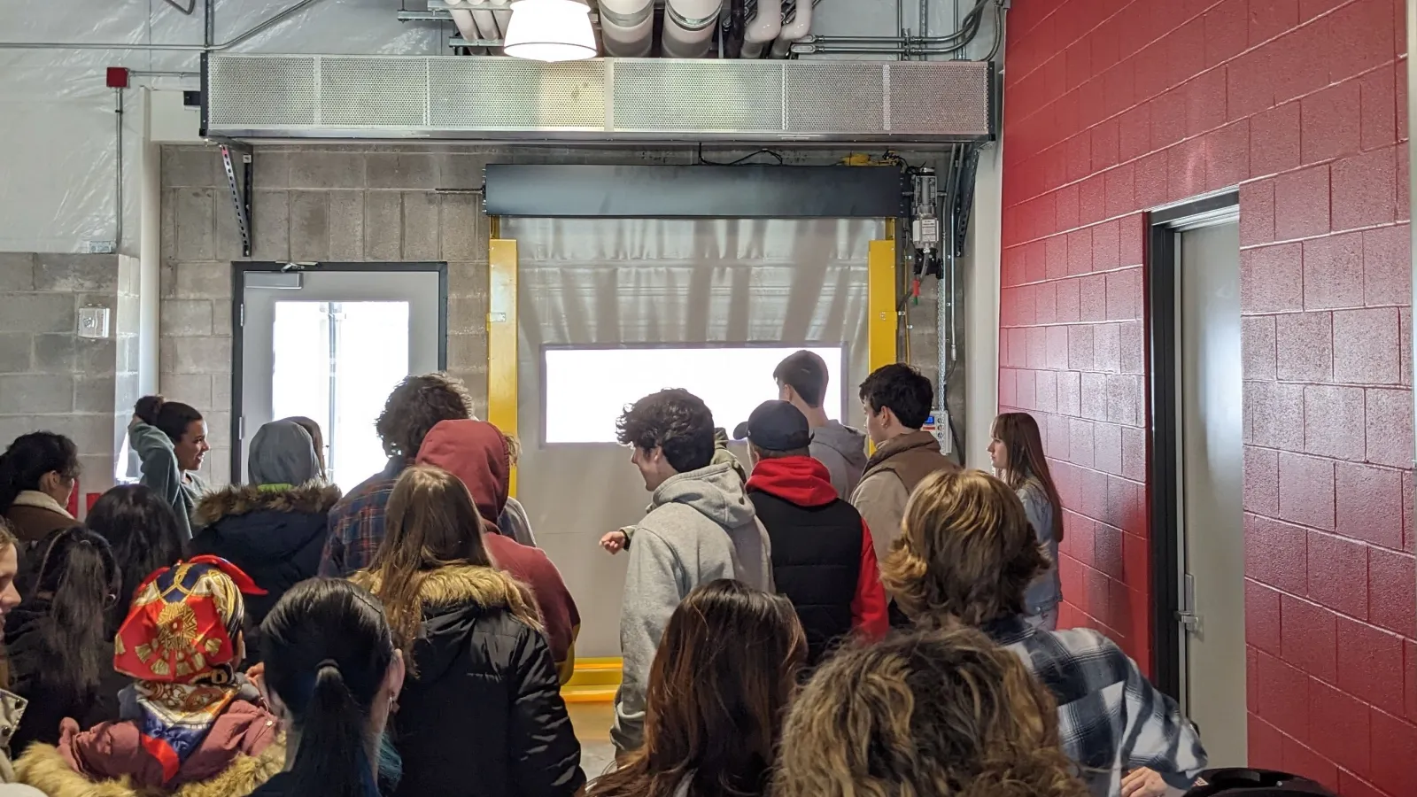 The students await entry to the greenhouses