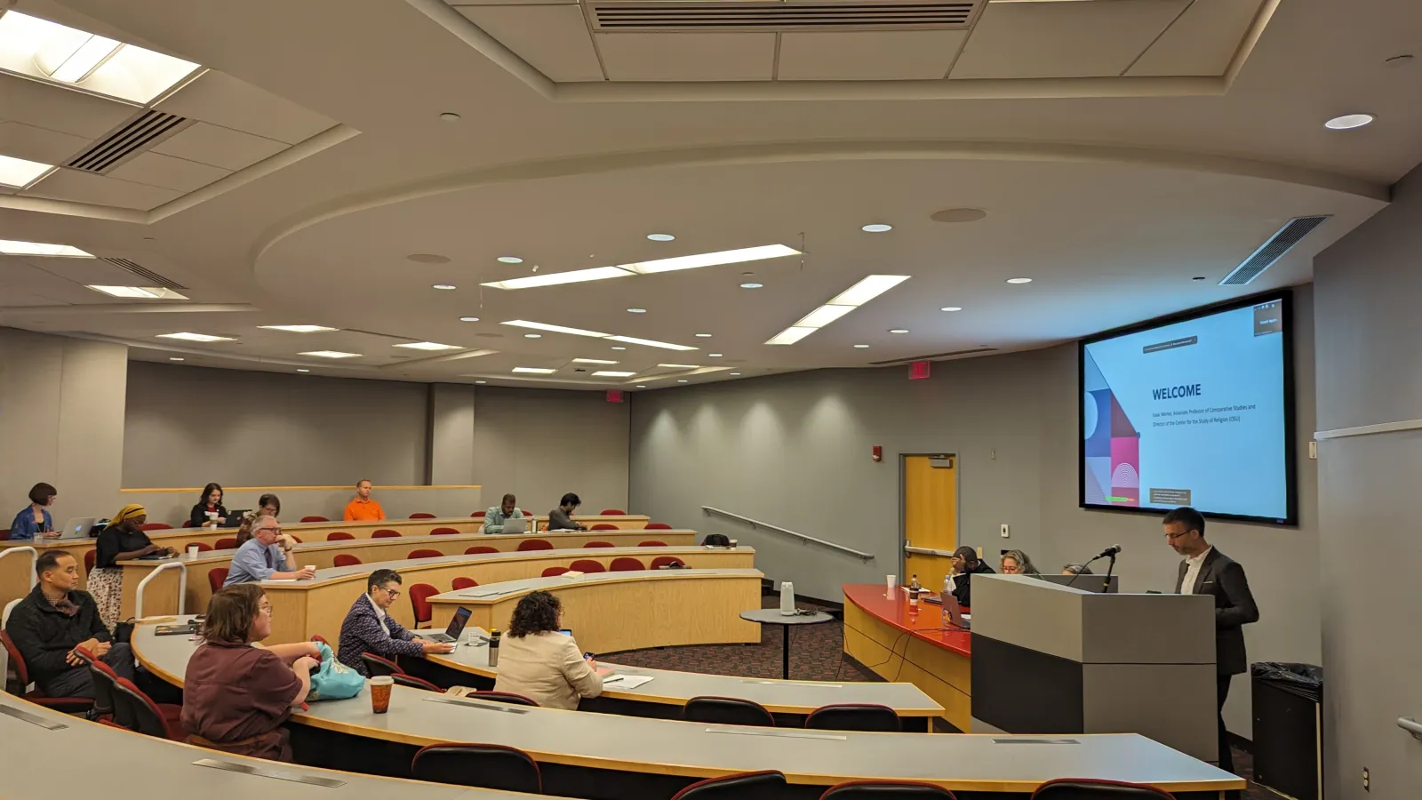 Participants sitting in stadium style seating