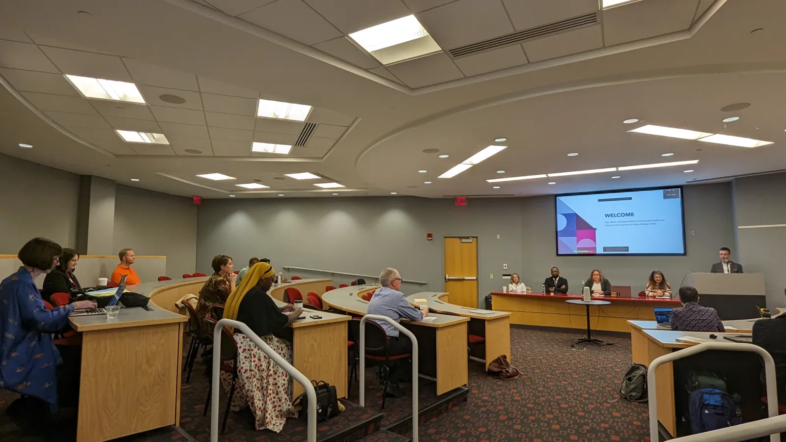 Participants sitting in stadium style seating