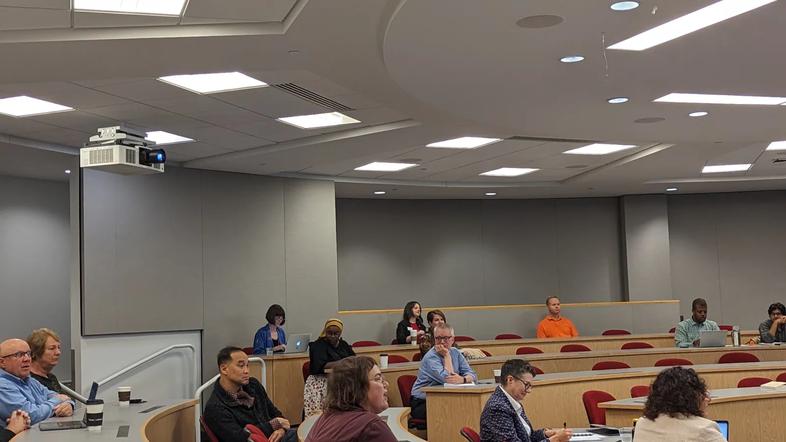 Participants sitting in stadium style seating