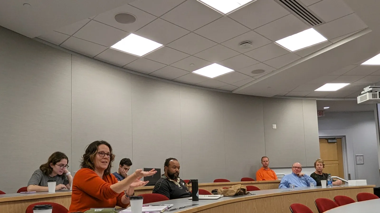 Participants sitting in stadium style seating