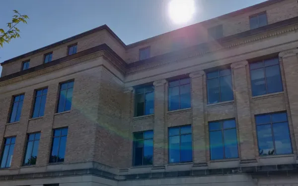 front of a building (Hagerty), with the sun at the top of the building