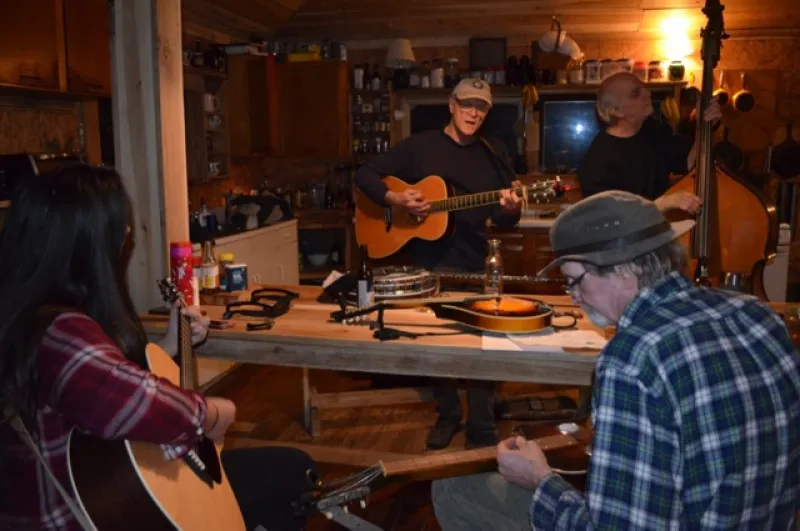 Ethnomusicology student, Sophia Enriquez, jams with Kevin Bradbury and Brian and Ronny Richards at Brian’s home on “Bloody Twin,” bordering Shawnee State Forest.