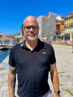 Zach with glasses and dark polo