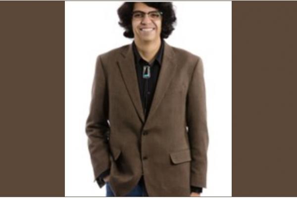 Dr. Gregorio Gonzales with glasses and brown sport coat