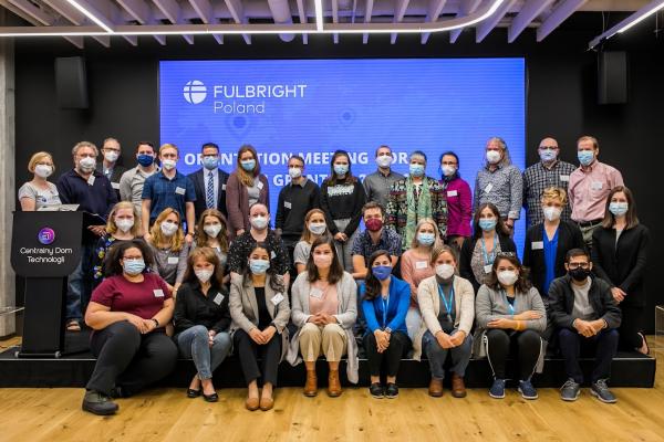 A group of people indoors wearing face masks