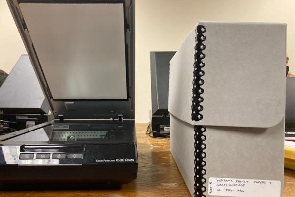 Photo of scanner and archive box sitting on a table