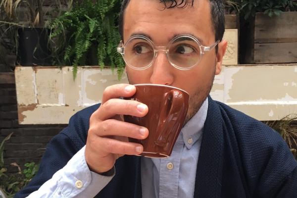 Photo of Dan DiPiero drinking out of a mug