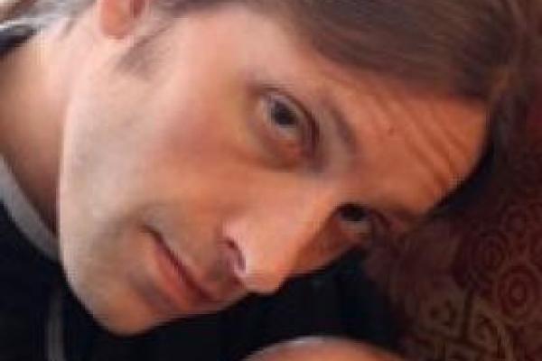 Professor Hugh Urban with his child